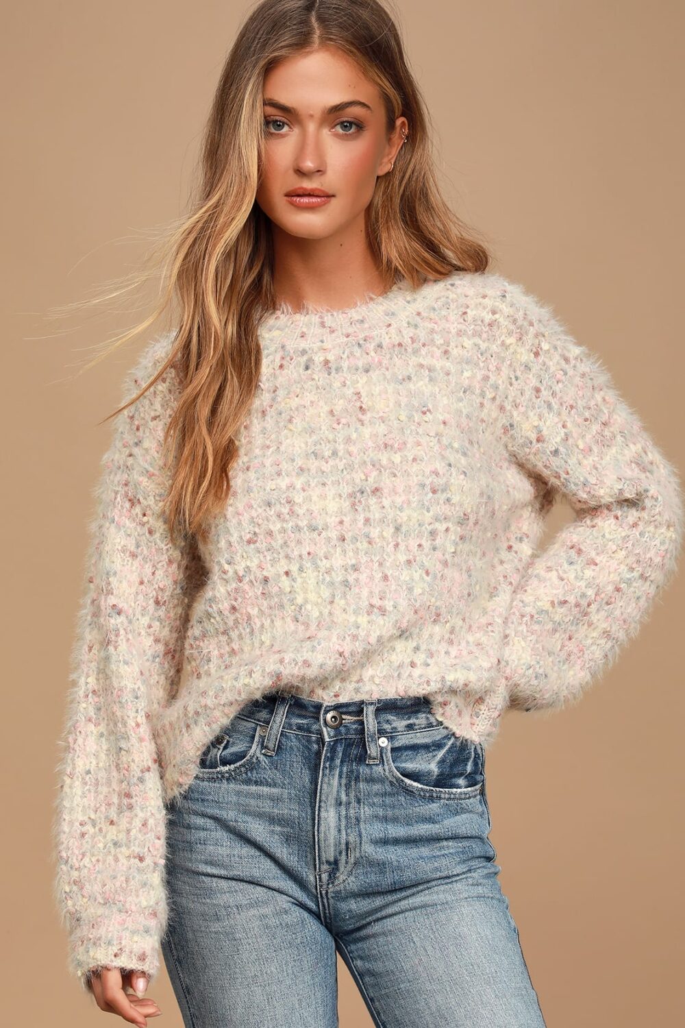 The blush pink soft fuzzy knit sweater is ready to welcome the season of cuddles The confetti like strands of pink blue and cream in this sweater are adorable.