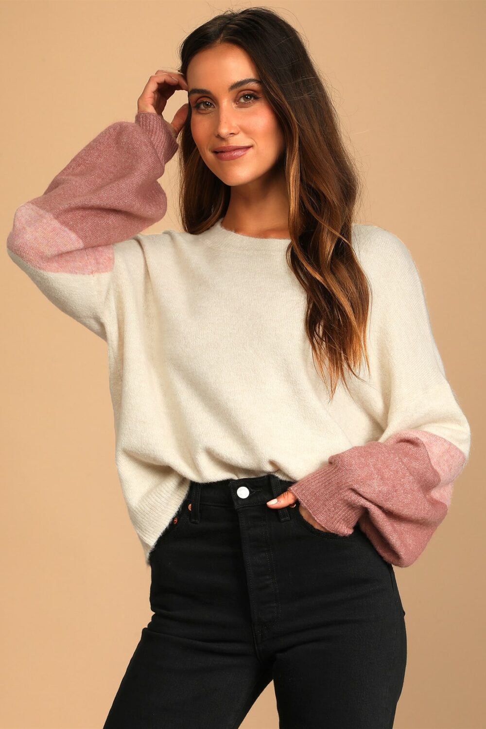The weather is becoming chilly but this cream color block knit sweater with pink and mauve stripes on the balloon sleeves will keep you warm and cozy that will ease you into the new season