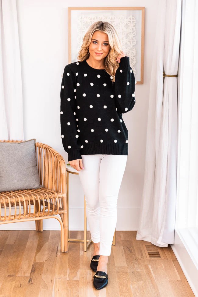 This fall keep it classic with a black Pom sweater white jeans and black booties.