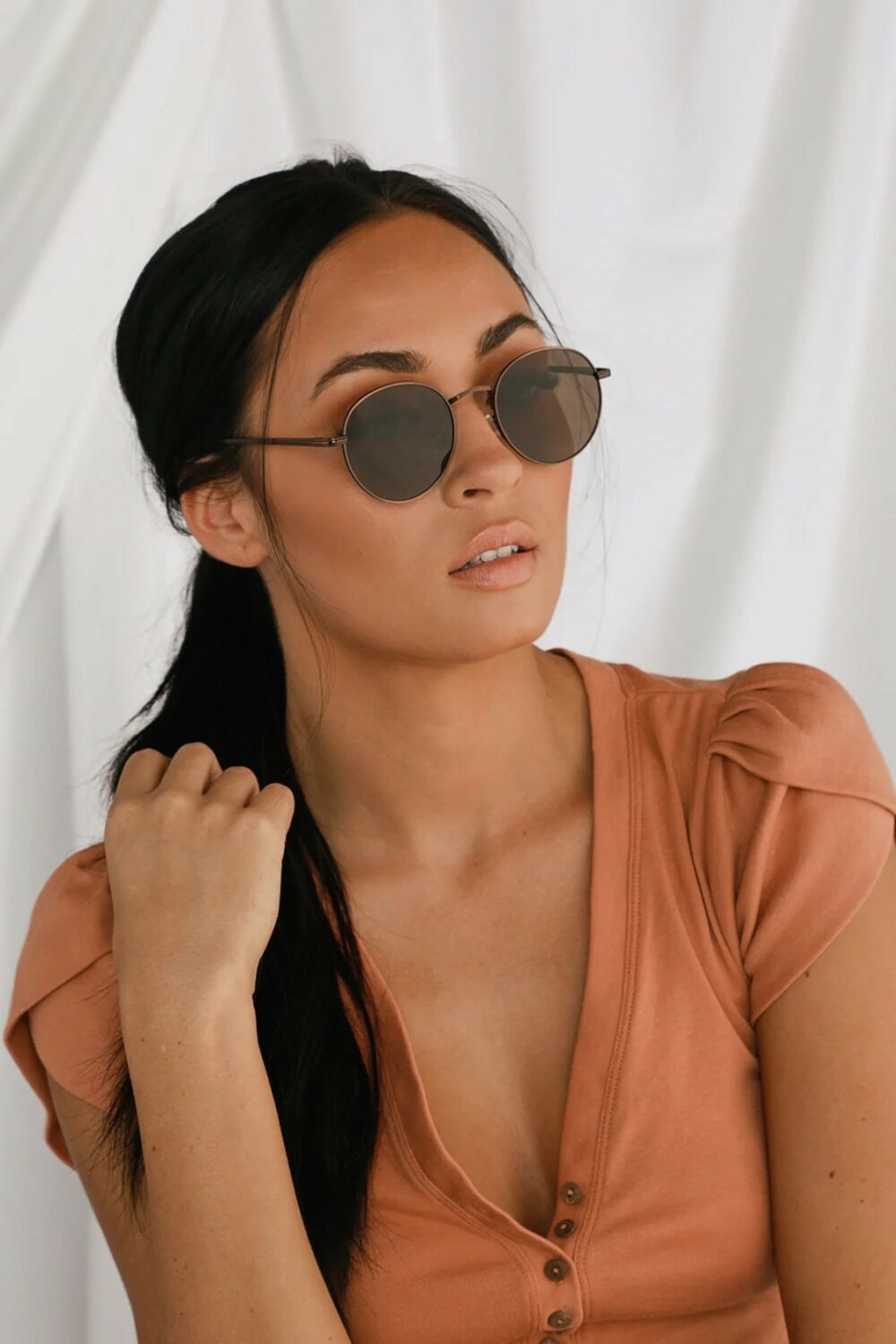 Womens new favorite pair of sunglasses in a modern bronze wire frame with brown tinted lenses is here If youre wearing the Agreed Bronze Round Sunglasses the sun has no chance.