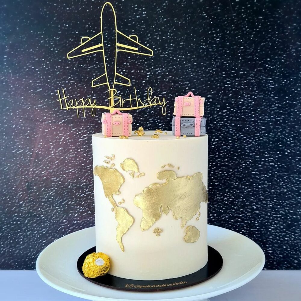 A beautiful Pink and Golden adorned map Cake just the thing to send to your closest travel lover buddy.