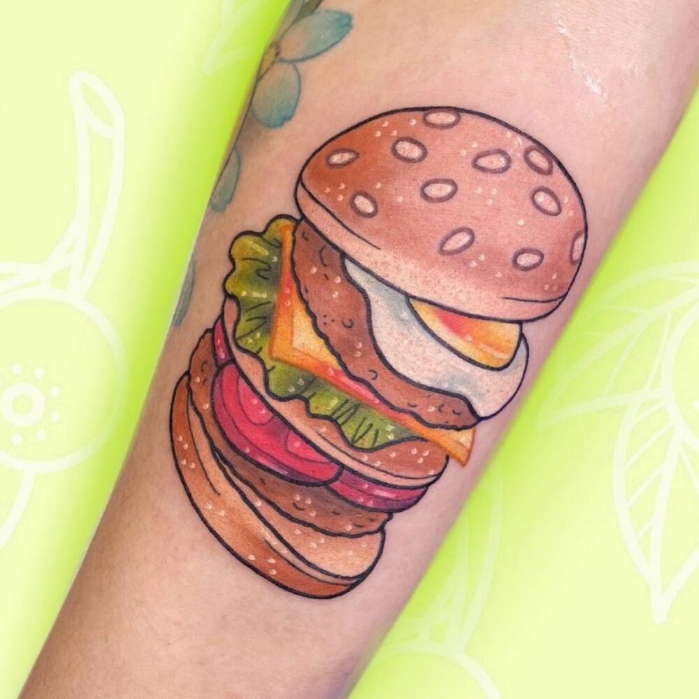 A tattoo of an illustrated burger may surprise you. Whether you get it tattooed on your arm or rib youll look badass and feel the urge to eat