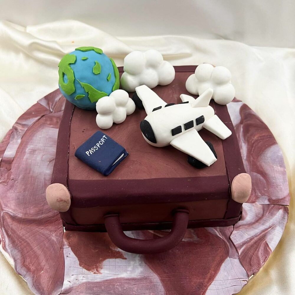 Give your loved ones a piece of this delicious cake shaped like a suitcase and send your best travel wishes their way.