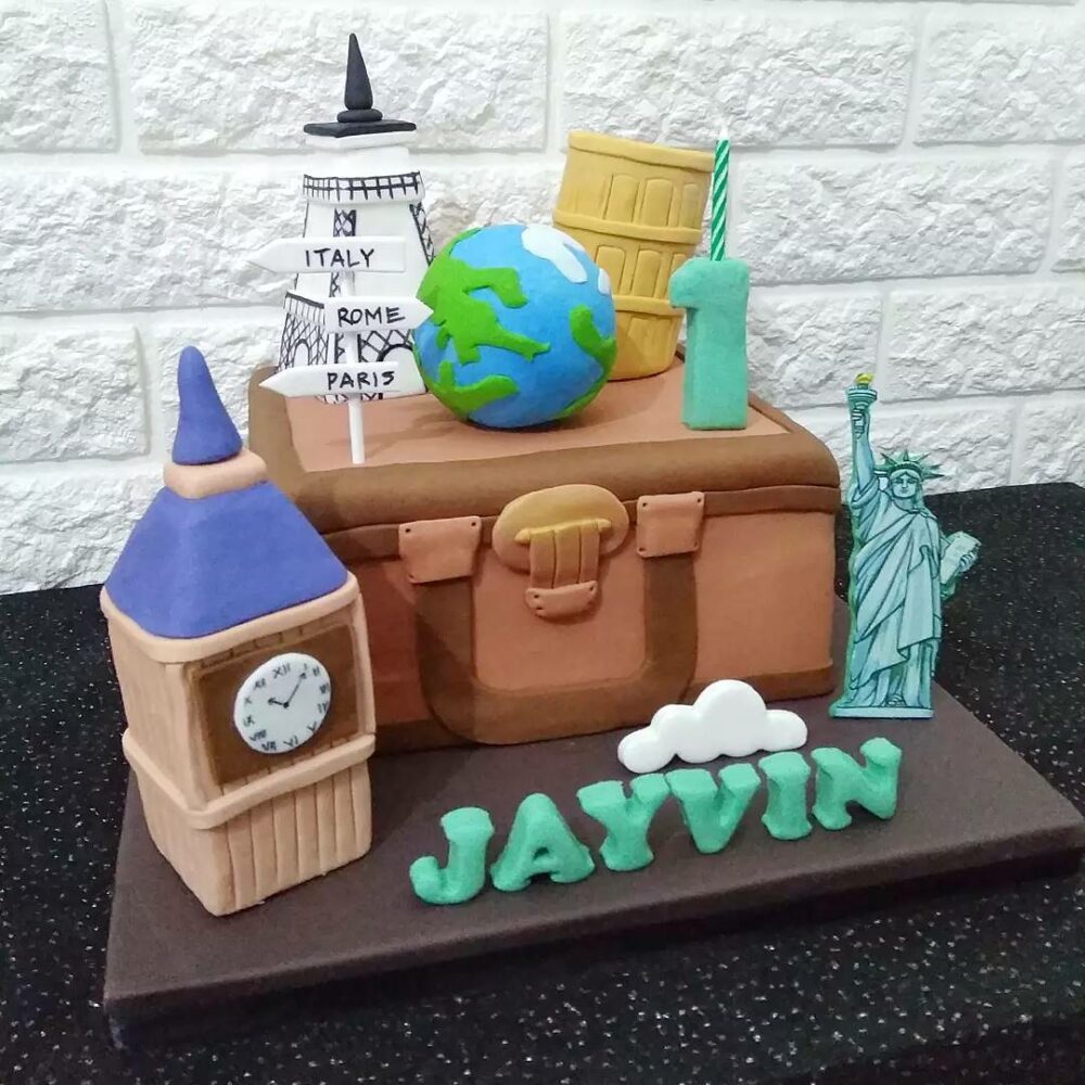 Have a piece of this delicious travel themed cake in the style of a suitcase complete with a globe on top and send it to your loved ones with your wishes.