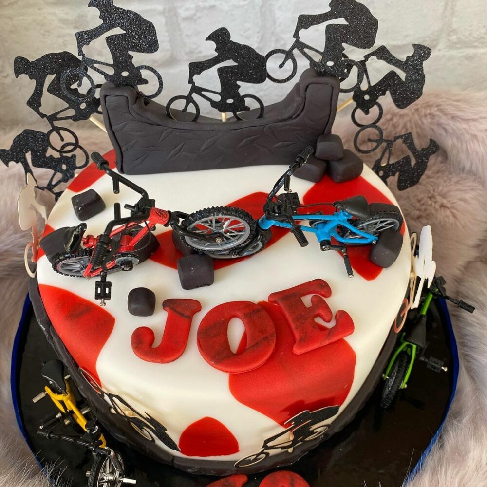 In the spirit of adventure on the open road try this red and black travel motorbike cake.