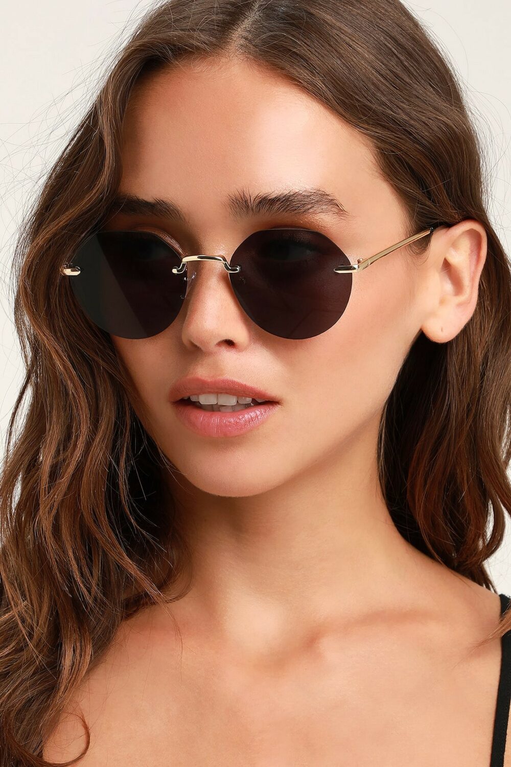 Sunglasses for a Brunch Date on a Sunday kick off the weekend in style. These chic shades are a unique round form and include black tinted lenses.