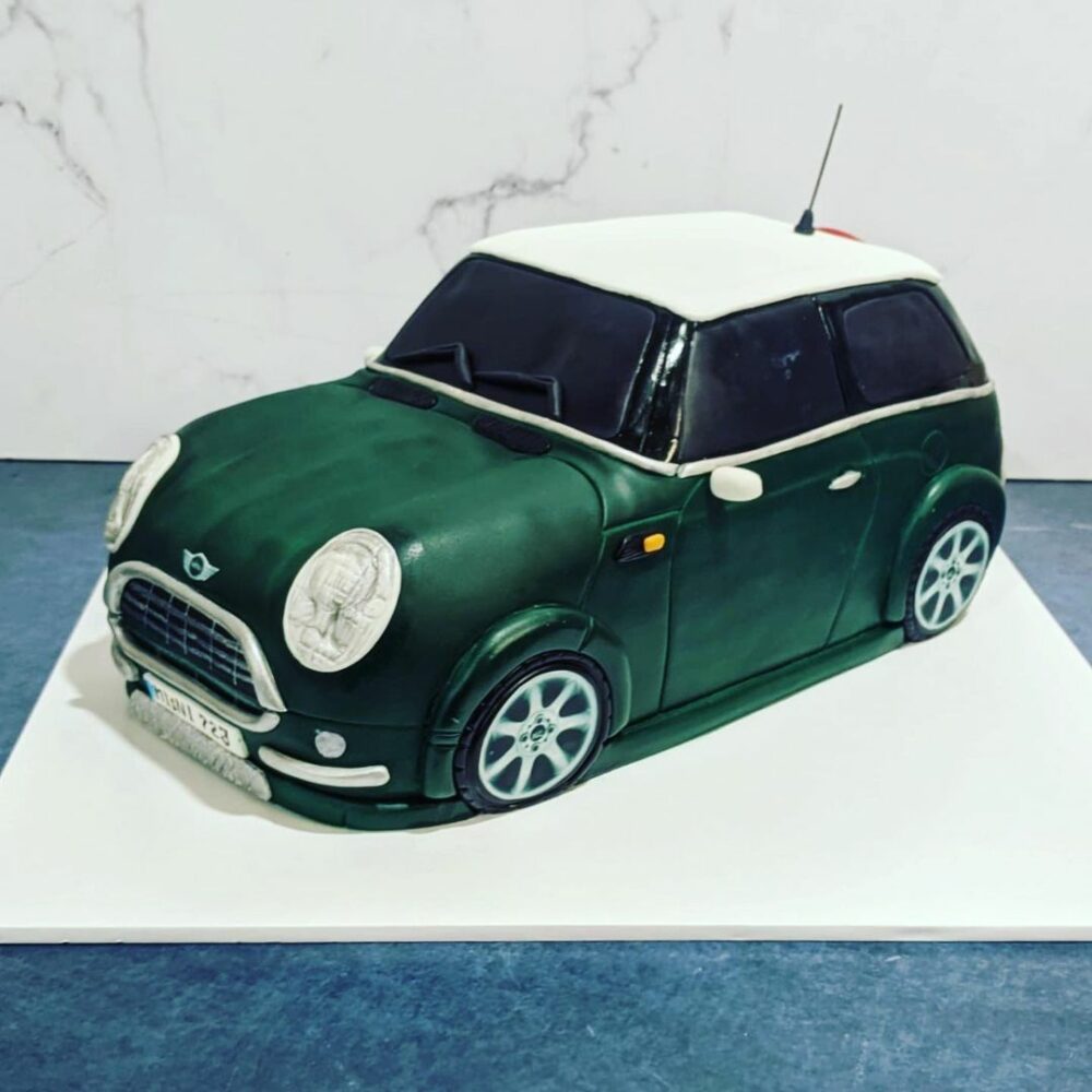 This green car cake is the best choice if you want to surprise your champ with a cake based on a bike trip.