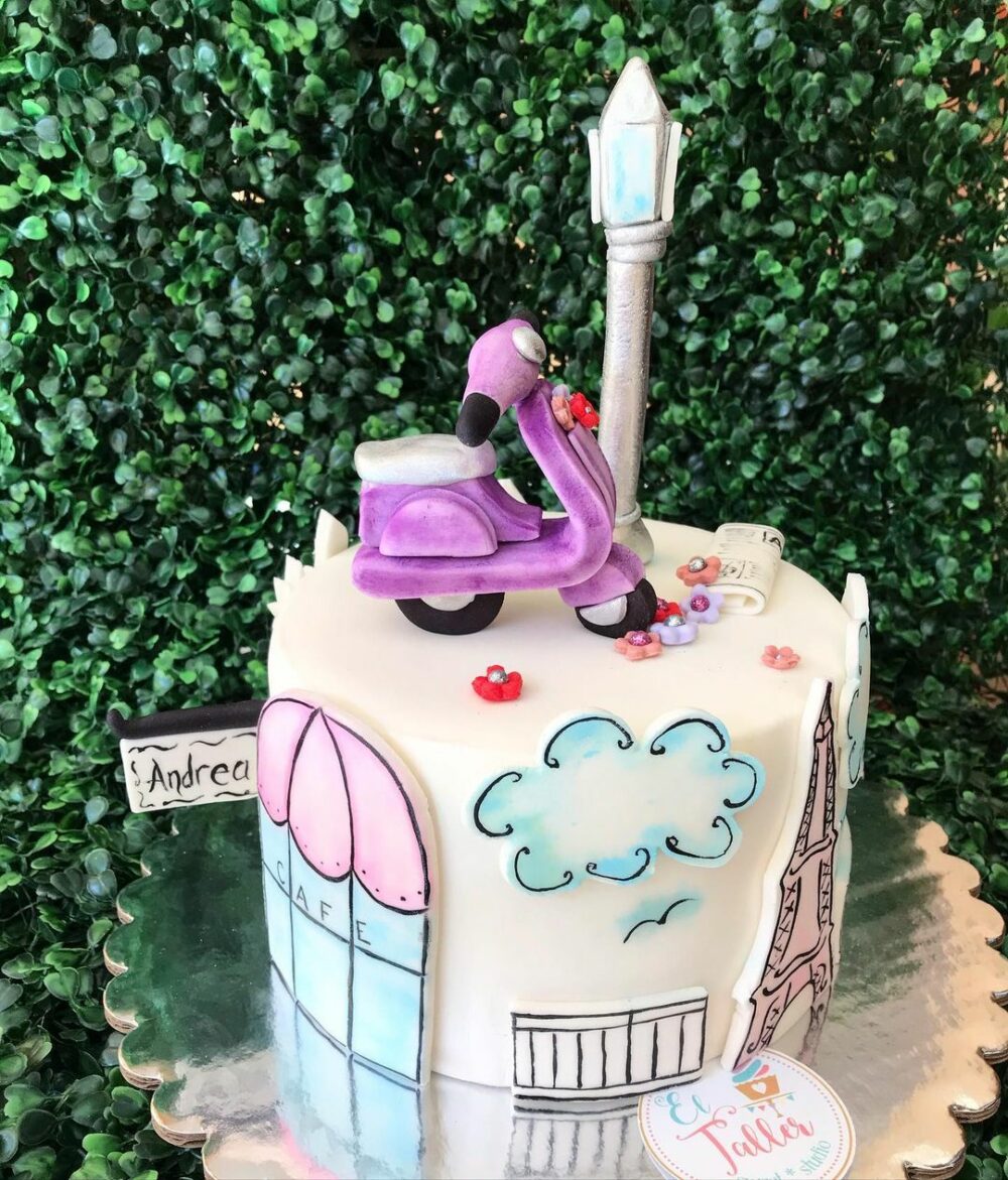 This pink scooty travel themed cake idea will take you to Paris in style.