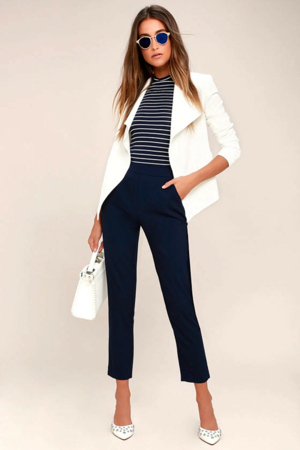 Wear these navy high waisted pants Loose fitting trousers with a slimming ankle cuff. Hidden side zipperhook clasp.