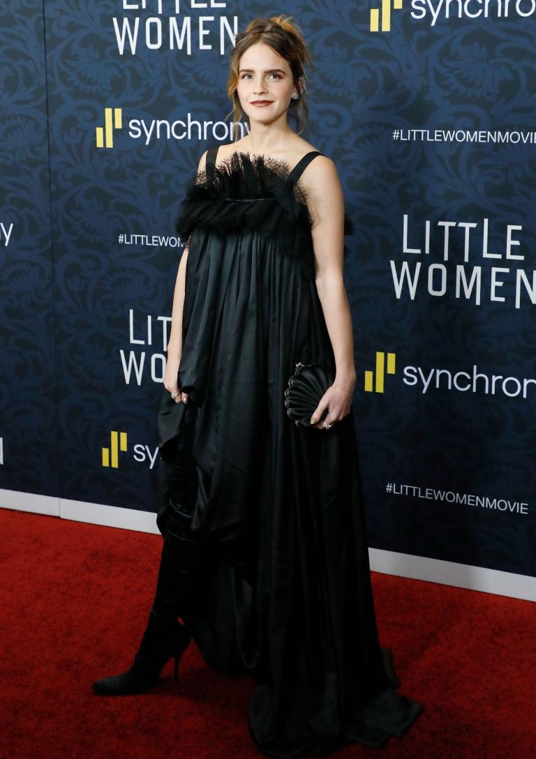 Emma Watson looks really stunning in this long black dress and heels.